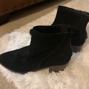 Black suede ankle booties with zipper in back